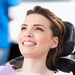 Woman leaning back in chair and smiling