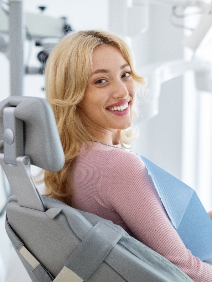 Female dental patient looking back and smiling